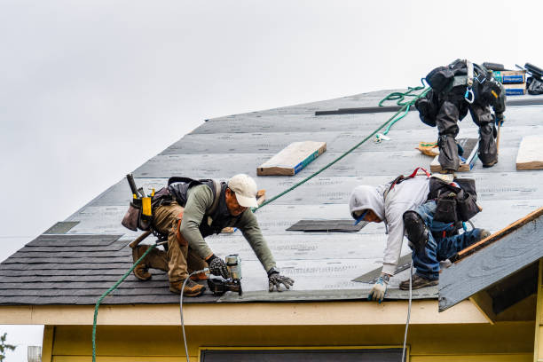 Professional Gutter Installation technician working in Dedham, MA